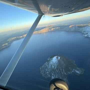 Flying over Crater Lake at sunset