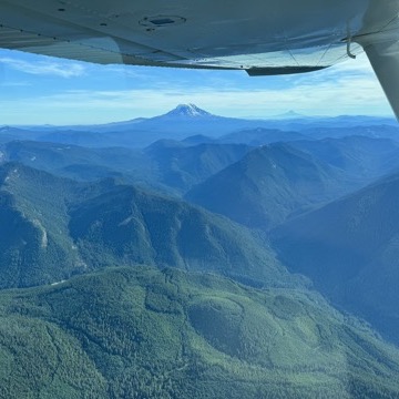 Flying past the Cascades with Mt. Rainier in the distance